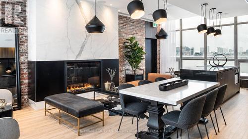 601 - 555 College Street, Toronto, ON - Indoor Photo Showing Dining Room With Fireplace