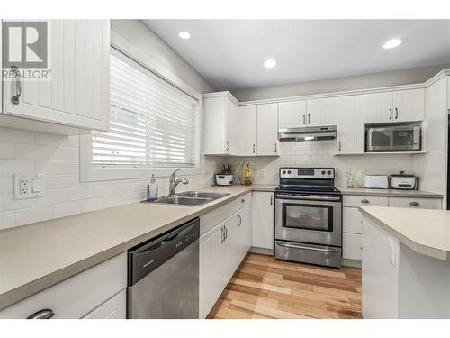 120 Hartman Road Unit# 110, Kelowna, BC - Indoor Photo Showing Kitchen With Double Sink