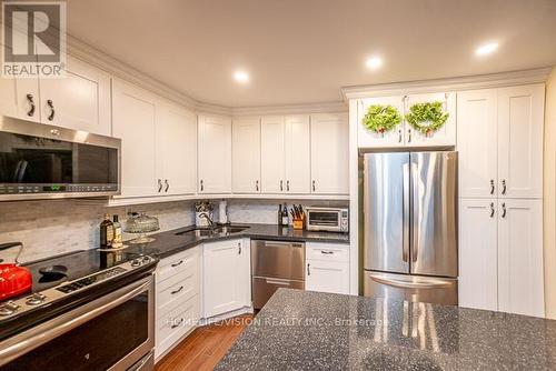 R1-1 - 60 Pavane Linkway, Toronto (Flemingdon Park), ON - Indoor Photo Showing Kitchen With Stainless Steel Kitchen With Double Sink With Upgraded Kitchen