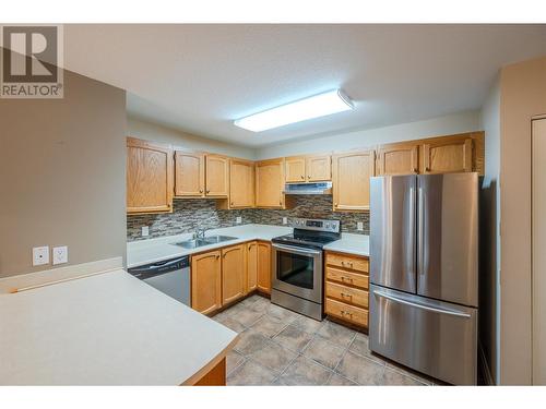 187 Warren Avenue W Unit# 206, Penticton, BC - Indoor Photo Showing Kitchen With Stainless Steel Kitchen With Double Sink