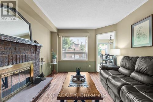 19 Peck Street, Barrie (Painswick North), ON - Indoor Photo Showing Living Room With Fireplace