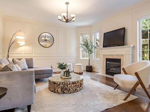 12 Coakwell Dr, Markham, ON - Indoor Photo Showing Living Room With Fireplace