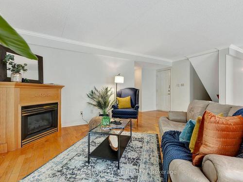 23-2120 Headon Rd, Burlington, ON - Indoor Photo Showing Living Room With Fireplace