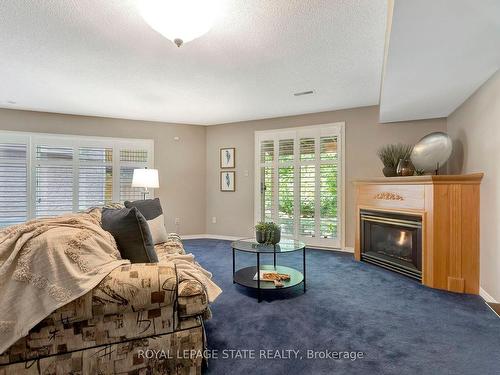 23-2120 Headon Rd, Burlington, ON - Indoor Photo Showing Living Room With Fireplace