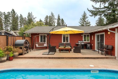 677 Drummond Court, Kelowna, BC - Outdoor With In Ground Pool With Deck Patio Veranda