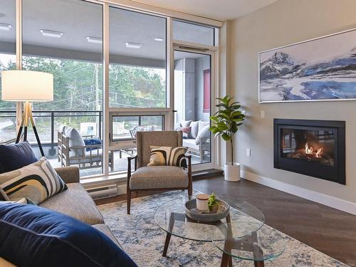 306-3529 Dolphin Dr, Nanoose Bay, BC - Indoor Photo Showing Living Room With Fireplace