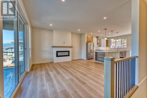 7760 Okanagan Landing Road Unit# 130, Vernon, BC - Indoor Photo Showing Other Room With Fireplace