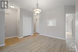 Foyer off dining room with front & back access and a closet in the middle. - 