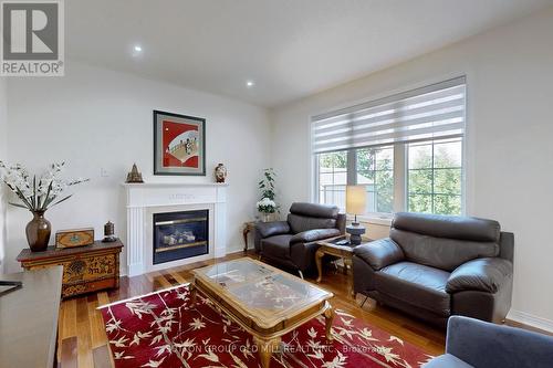 22 Nichols Boulevard, Markham (Cachet), ON - Indoor Photo Showing Living Room With Fireplace