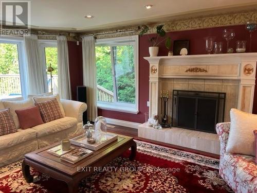 23 Quigg Lane, Prince Edward County (Ameliasburgh), ON - Indoor Photo Showing Living Room With Fireplace