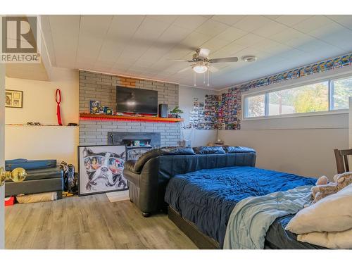 538 7Th  Avenue, Castlegar, BC - Indoor Photo Showing Bedroom With Fireplace