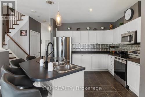 106 Port Of Newcastle Drive, Clarington (Newcastle), ON - Indoor Photo Showing Kitchen With Stainless Steel Kitchen With Double Sink With Upgraded Kitchen