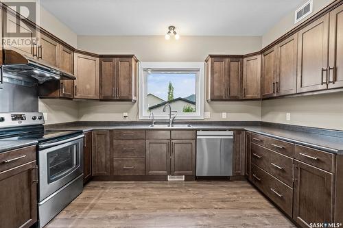 214 Wyant Lane, Saskatoon, SK - Indoor Photo Showing Kitchen With Double Sink