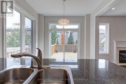 2463 Millstone Drive, Oakville (West Oak Trails), ON - Indoor Photo Showing Kitchen With Fireplace With Double Sink