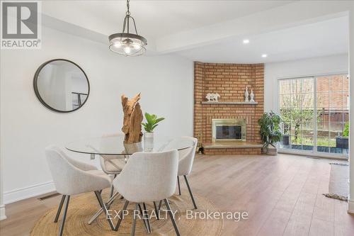 30 - 365 Tailfeather Crescent, Mississauga (Hurontario), ON - Indoor Photo Showing Dining Room With Fireplace