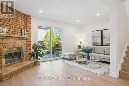 30 - 365 Tailfeather Crescent, Mississauga (Hurontario), ON - Indoor Photo Showing Living Room With Fireplace