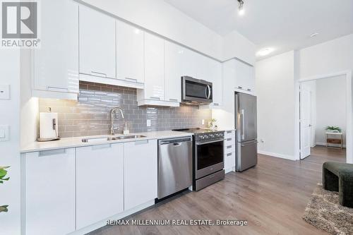 101 - 65 Watergarden Drive, Mississauga (Hurontario), ON - Indoor Photo Showing Kitchen With Stainless Steel Kitchen With Double Sink With Upgraded Kitchen