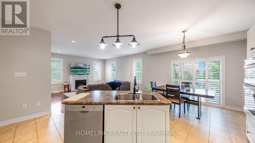 1643 Coldstream Drive, Oshawa (Taunton), ON - Indoor Photo Showing Kitchen With Fireplace With Double Sink