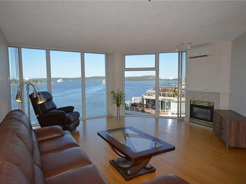 601-154 Promenade Dr, Nanaimo, BC - Indoor Photo Showing Living Room With Fireplace