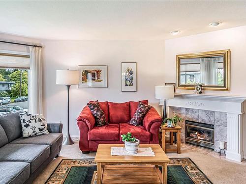 208-134 Fifth Ave, Qualicum Beach, BC - Indoor Photo Showing Living Room With Fireplace