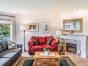 208-134 Fifth Ave, Qualicum Beach, BC  - Indoor Photo Showing Living Room With Fireplace 