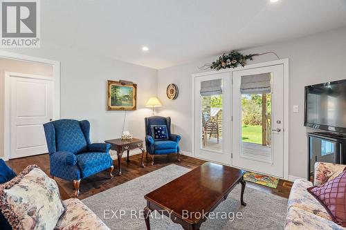 Living room double doors to your covered deck. - 295 Station Street, North Middlesex (Parkhill), ON - Indoor Photo Showing Living Room