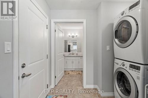 Double stacked laundry in a practical space. - 295 Station Street, North Middlesex (Parkhill), ON - Indoor Photo Showing Laundry Room