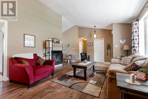 10 Simpson Street W, Mapleton (Alma), ON - Indoor Photo Showing Living Room With Fireplace