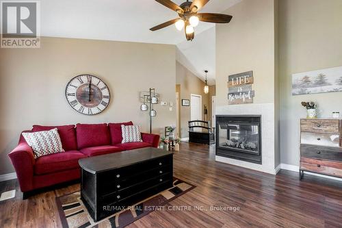 10 Simpson Street W, Mapleton (Alma), ON - Indoor Photo Showing Living Room With Fireplace