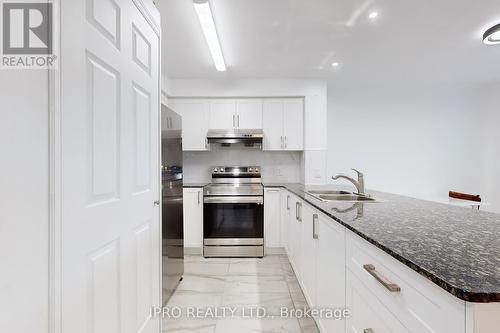 202 - 4600 Steeles Avenue E, Markham (Milliken Mills East), ON - Indoor Photo Showing Kitchen With Double Sink