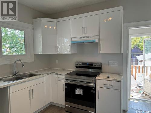 101 28Th Street W, Saskatoon, SK - Indoor Photo Showing Kitchen With Double Sink