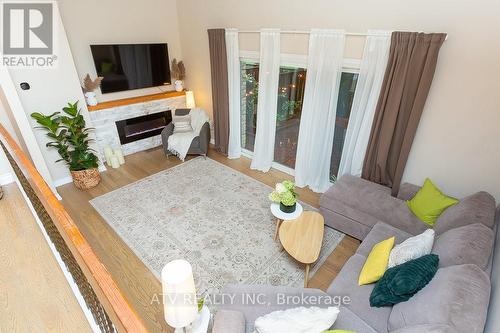 23 - 400 Bloor Street, Mississauga (Mississauga Valleys), ON - Indoor Photo Showing Living Room With Fireplace