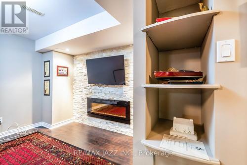 102 - 10 Bassett Boulevard, Whitby (Pringle Creek), ON - Indoor Photo Showing Other Room With Fireplace