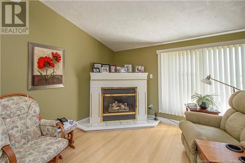 1185 Route 133 Road, Barachois, NB - Indoor Photo Showing Living Room With Fireplace