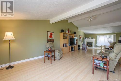 1185 Route 133 Road, Barachois, NB - Indoor Photo Showing Living Room With Fireplace