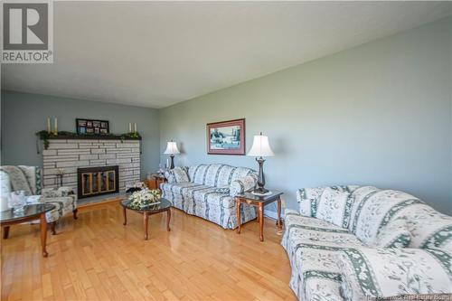 1185 Route 133 Road, Barachois, NB - Indoor Photo Showing Living Room With Fireplace