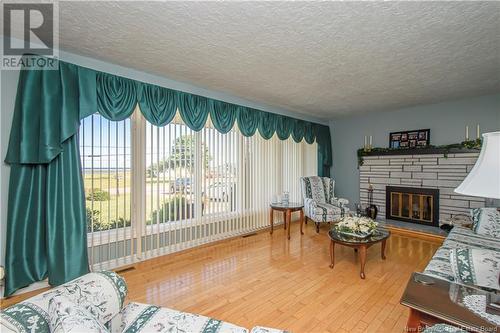 1185 Route 133 Road, Barachois, NB - Indoor Photo Showing Living Room With Fireplace