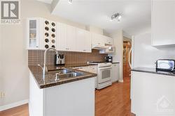 Large kitchen with plenty of cabinet and counter space - 