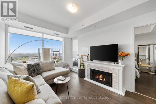 1210 - 2481 Taunton Road, Oakville (Uptown Core), ON - Indoor Photo Showing Living Room With Fireplace