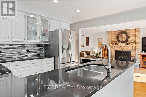 10 Thompson Court S, Belleville, ON - Indoor Photo Showing Kitchen With Fireplace With Double Sink With Upgraded Kitchen