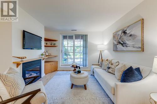 102 - 2371 Queen Street E, Toronto (The Beaches), ON - Indoor Photo Showing Living Room With Fireplace