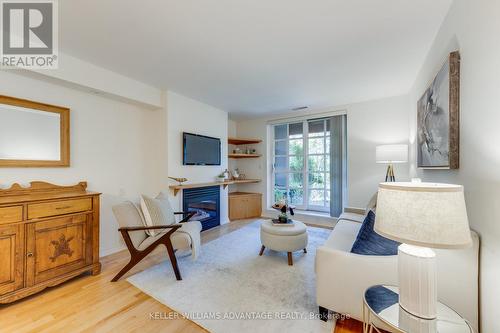 102 - 2371 Queen Street E, Toronto (The Beaches), ON - Indoor Photo Showing Living Room With Fireplace