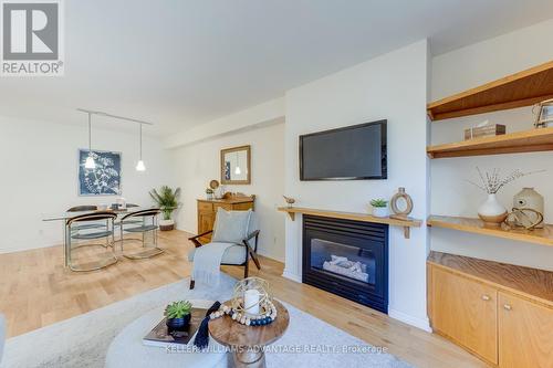 102 - 2371 Queen Street E, Toronto (The Beaches), ON - Indoor Photo Showing Living Room With Fireplace