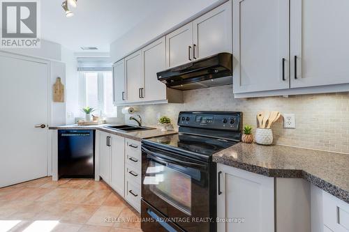 102 - 2371 Queen Street E, Toronto (The Beaches), ON - Indoor Photo Showing Kitchen With Double Sink