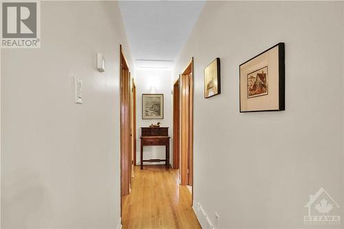 Hallway to bedrooms with refinished hardwood flooring. - 2536 Traverse Drive, Ottawa, ON - Indoor Photo Showing Other Room