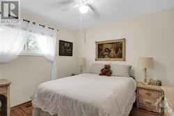 Primary Bedroom...note light fixture with ceiling fan. - 