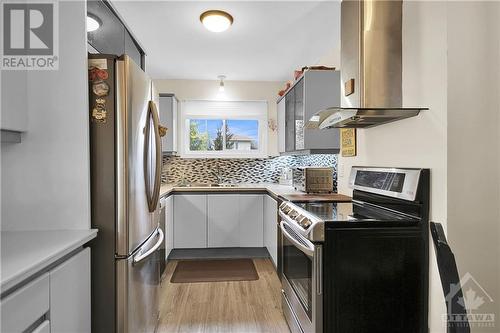 Stainless steel hood fan in kitchen. - 2536 Traverse Drive, Ottawa, ON - Indoor Photo Showing Kitchen With Stainless Steel Kitchen