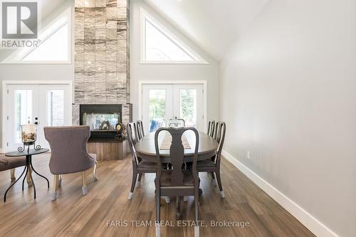 94 42Nd Street S, Wasaga Beach, ON - Indoor Photo Showing Dining Room With Fireplace