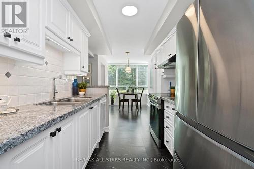 104 - 55 The Boardwalk Way, Markham (Greensborough), ON - Indoor Photo Showing Kitchen With Double Sink With Upgraded Kitchen