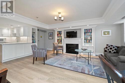 104 - 55 The Boardwalk Way, Markham (Greensborough), ON - Indoor Photo Showing Living Room With Fireplace